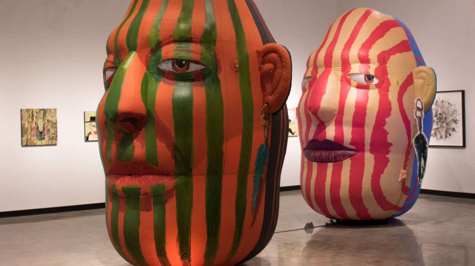 Giant inflatable head sculptures at The Frank Art Gallery exhibition in Pembroke Pines, Florida