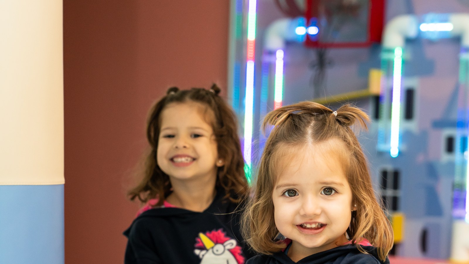 Bright pastel indoor play structure with ball pit and colorful steps at Little Kids Playzone in Pembroke Pines, designed for children ages 0 to 6