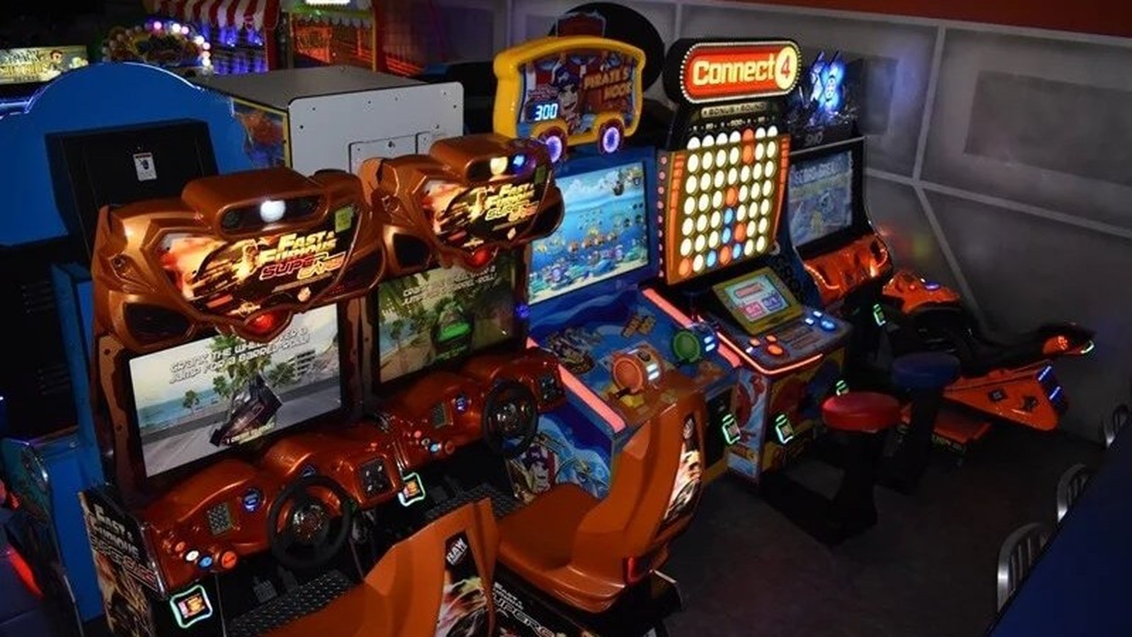 Rocket World indoor arcade with Fast & Furious racing games and colorful game cabinets in Pembroke Pines, Florida