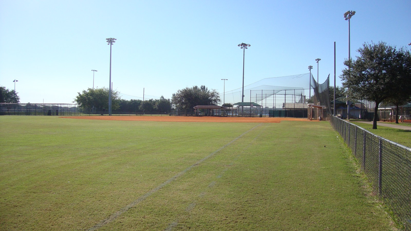 Pembroke Shores Park baseball fields, covered dugout, and open green space in Pembroke Pines, Florida