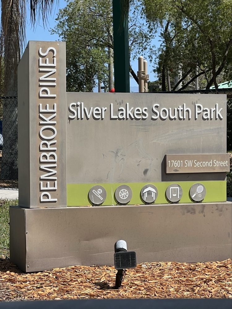 Silver Lakes South Park entrance sign with playground and trees at 17601 SW Second Street in Pembroke Pines, Florida