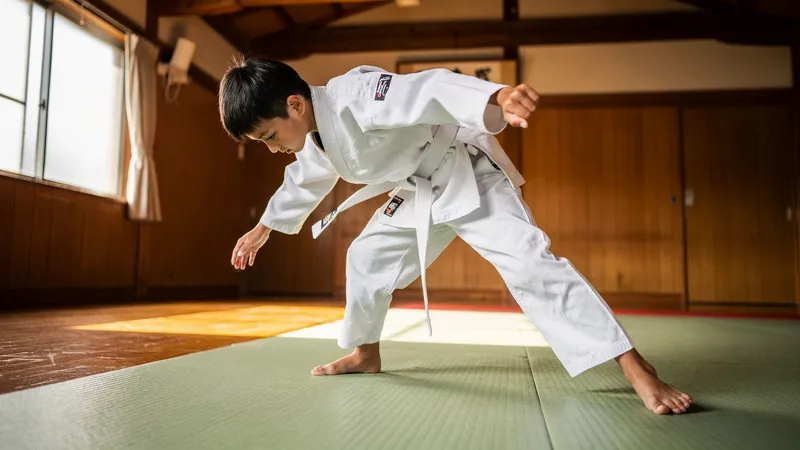 Young students practicing traditional judo techniques on tatami mats