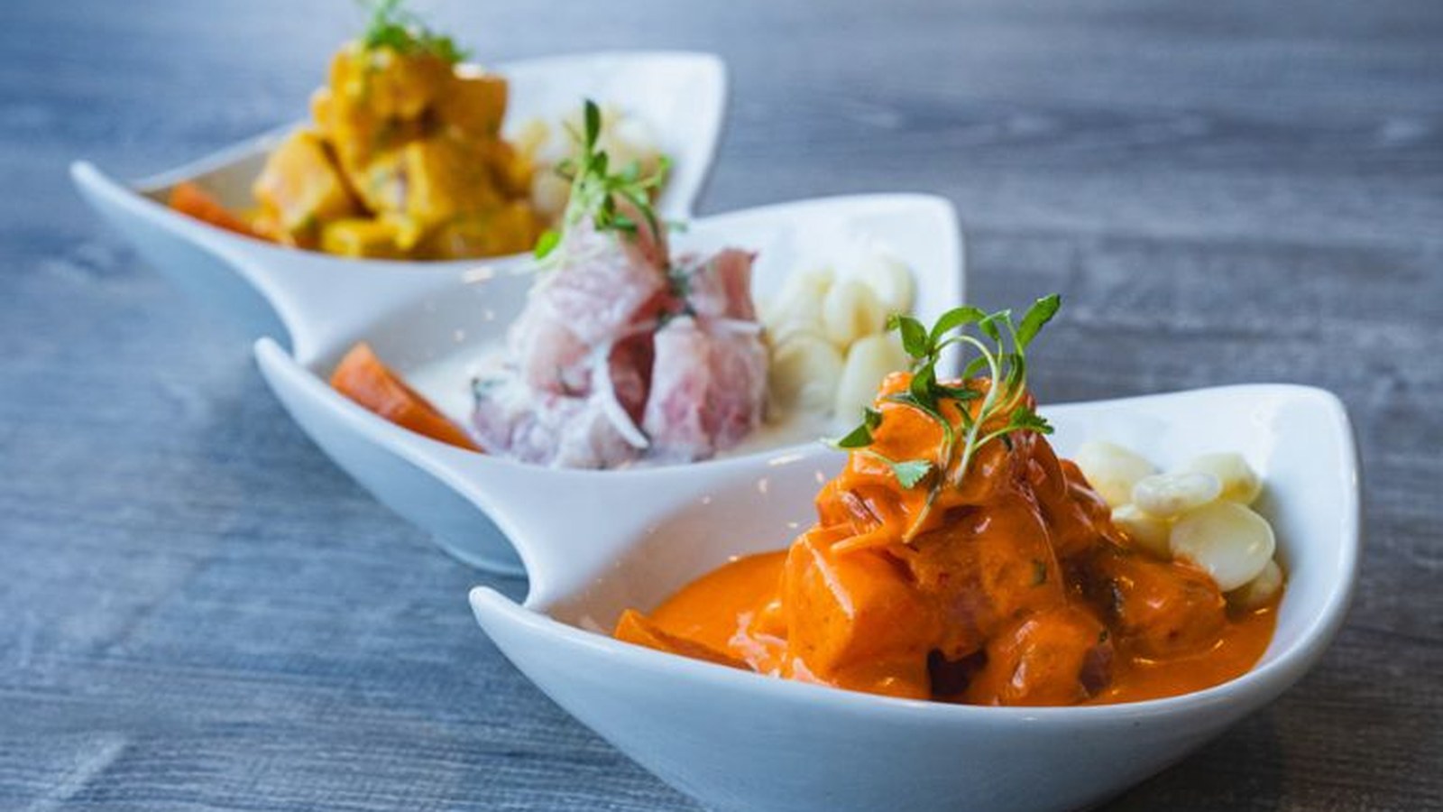 Embarcadero 41 dining room with warm wood tones and soft lighting — a cozy Peruvian Nikkei restaurant in Pembroke Pines