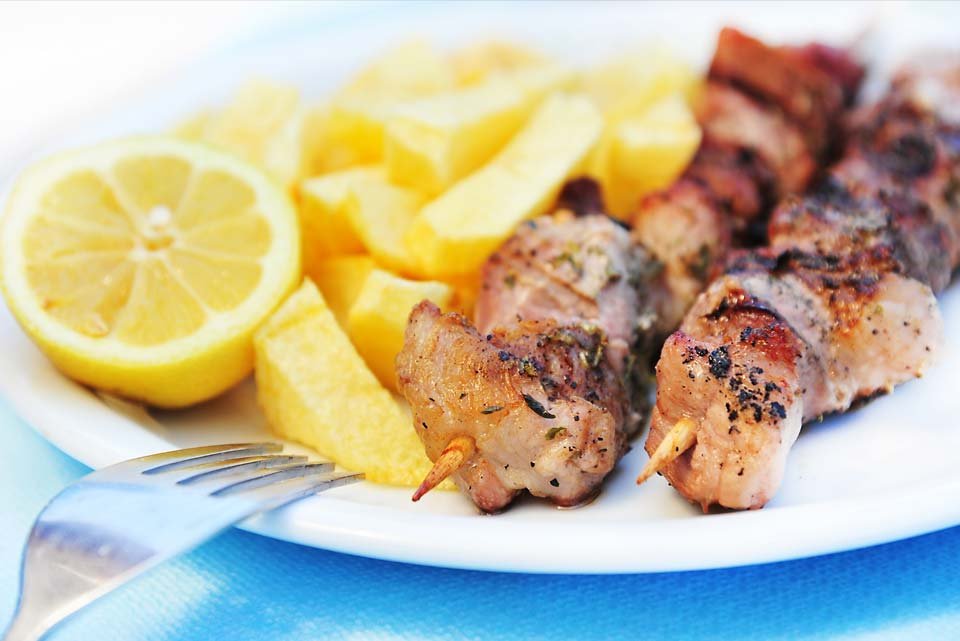 Mezes Greek Taverna mezze spread with hummus and grilled meats